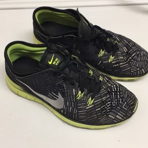 Black and yellow Nike sneakers